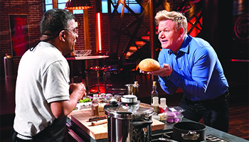 Contestant Subha with host and chef Gordon Ramsay in "MasterChef" 